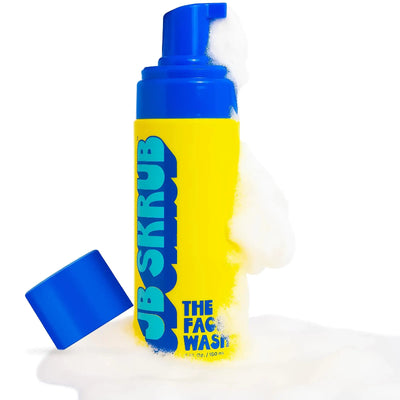 Gentle Facial Cleanser in a vibrant yellow and blue bottle with foam, perfect for nourishing and refreshing all skin types.