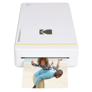 Kodak Mini Portable Mobile Instant Photo Printer printing a vibrant photo of a happy family at the beach.