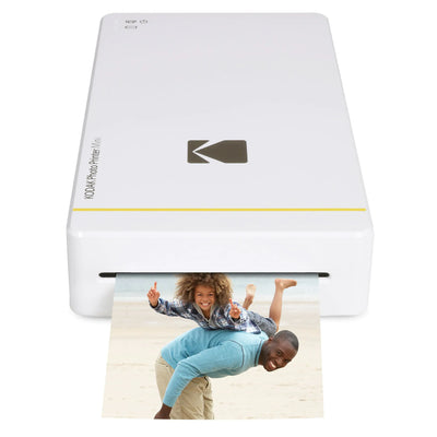 Kodak Mini Portable Mobile Instant Photo Printer printing a vibrant photo of a happy family at the beach.