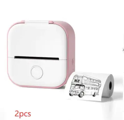 Portable Mini Thermal Label Printer in pink with label roll and printed bus design.