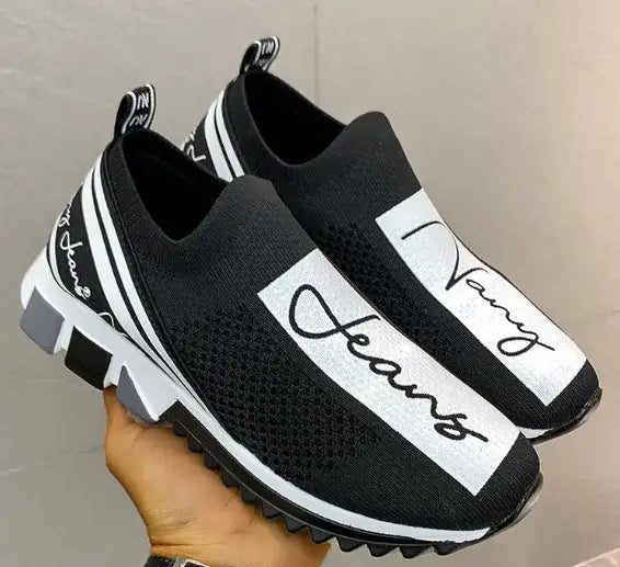 Stylish black and white breathable woven sneakers featuring 'Navy Jeans' branding for casual wear.