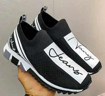 Stylish black and white breathable woven sneakers featuring 'Navy Jeans' branding for casual wear.