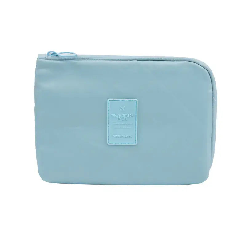 Travel Storage Bag for Digital Products and Cables in light blue color, ideal for organizing gadgets and cables.