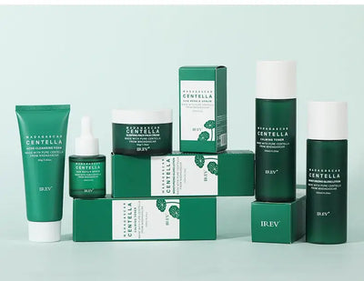 Centella Asiatica Extract Natural Facial Skin Care products displayed in green packaging on a light background.