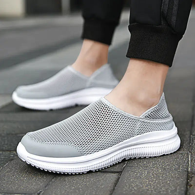 Slip-On Breathable Mesh Sneakers in grey, showcasing lightweight design and breathable mesh for comfort.
