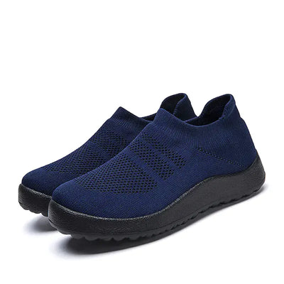 Casual Flyknit Slip-On Sneakers in navy blue, featuring a lightweight and breathable upper for all-day comfort.