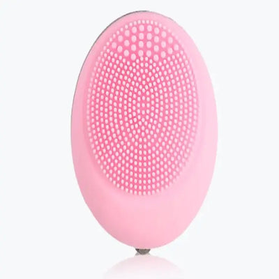 Electric Face Wash device in pink color with textured surface for deep cleansing and vibration technology.