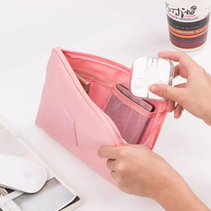 Travel Storage Bag for Digital Products and Cables filled with gadgets and accessories in a pink pouch.