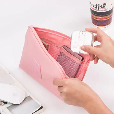 Travel Storage Bag for Digital Products and Cables filled with gadgets and accessories in a pink pouch.