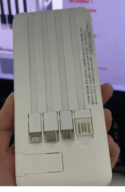 Back view of a 20000mAh Power Bank with integrated charging cables for reliable & portable charging.