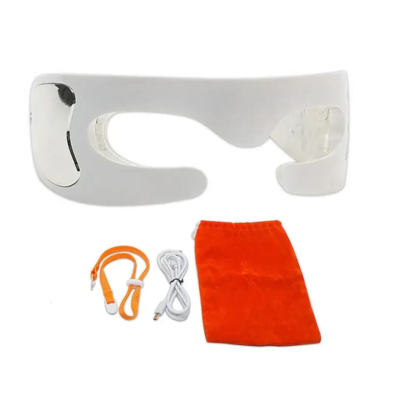 Eye Massager To Remove Dark Circles white device with accessories including charging cable and storage pouch