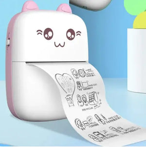 Portable Mini Bluetooth Printer printing cute images on paper with a joyful design, perfect for portability and fun.