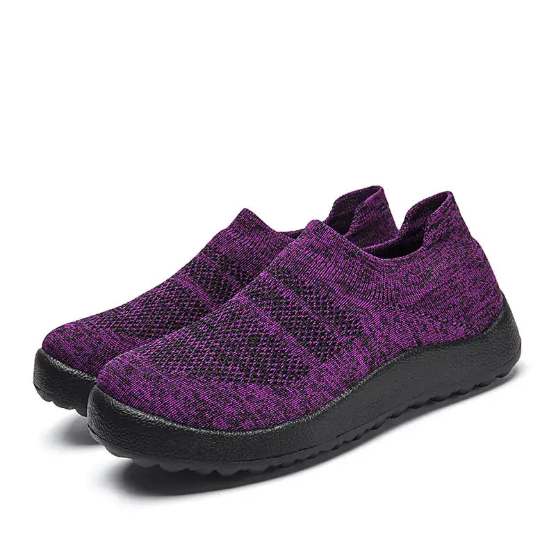 Casual Flyknit Slip-On Sneakers in purple color with a breathable knit upper and lightweight sole.