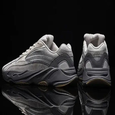 mens-and-womens-retro-mesh-sneakers in gray with a retro design and breathable mesh construction.