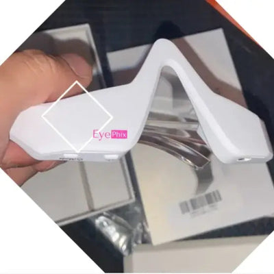 Beauty Eye Massage for Dark Circles device in white, designed to reduce puffiness and dark circles around the eyes.