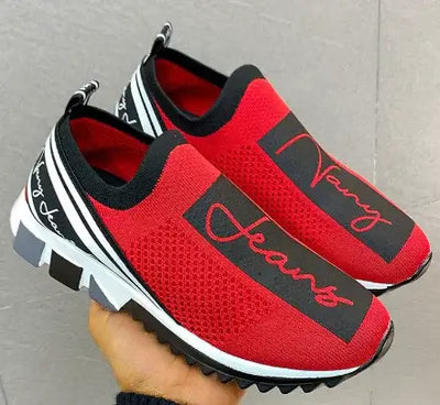 Red breathable sneakers with stylish black accents and 'Navy Jeans' branding, perfect for casual wear.