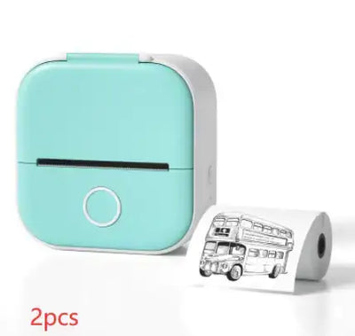 Portable Mini Thermal Label Printer in teal with printed label roll showing a double-decker bus illustration.