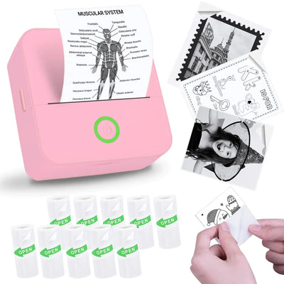 Vicbear Mini Sticker Printer in pink printing stickers with various designs and rolls of sticker paper.