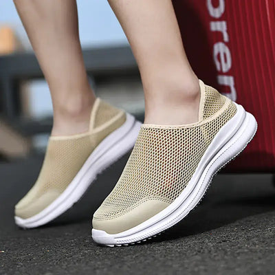Slip-On Breathable Mesh Sneakers worn by a person, showcasing lightweight and breathable design for comfort.